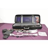 A Cartel archery set in hard zipped case with 8 Eastern arrows and accessories including string and
