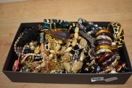 An assortment of costume jewellery, including a silver marcasite brooch, statement pieces, beaded