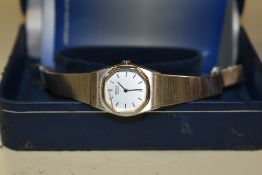 A Seiko stainless steel wristwatch, the octagonal silver dial having baton numerals, on a