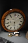 A 19th century oak cased station clock by Tallen of Barnsley, having Roman numerals and spade hands,