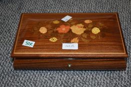 A wooden jewellery box having floral inlay, containing a small collection of costume jewellery