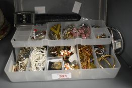 A small assortment of costume jewellery, including clip on earrings, hoop earrings, beaded jewellery