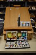 A modern pine artist's easel and storage box, measuring an elevated height of 50cm, together with