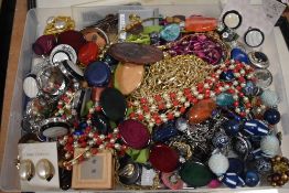 An assortment of costume jewellery, including clip on earrings, beaded necklaces, neck chains and