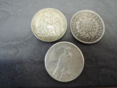 Three World Silver Coins, US 1922 Peace One Dollar, Peru 1923 Un Sol and French 1875 Five Francs,