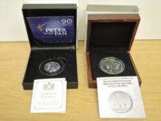 A London Mint 2013 Coronation Britannia Silver One Crown and a 2019 Peter Pan Silver 50P Coin both