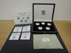 A Royal Mint 1984-1987 United Kingdom Four Coin £1 Silver Proof Piedfort Collection, all in