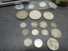 A collection of GB and World Silver Coins including Queen Victoria and George V Threepence, South