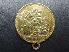 A 1824 George III Gold Sovereign, George & Dragon, Royal Mint, having gold coloured loop fitted, 8.