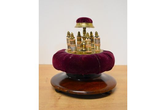 A late Victorian rotating bobbin-stand and pin cushion in purple velvet and brass with a mahogany - Image 2 of 15