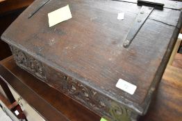 A period oak bible box of small proportions with carved panel to front, width approx. 56cm