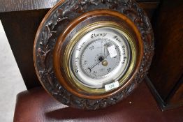 A vintage Smiths Shortland aneroid barometer having carved foliate surround, diameter approx. 31cm