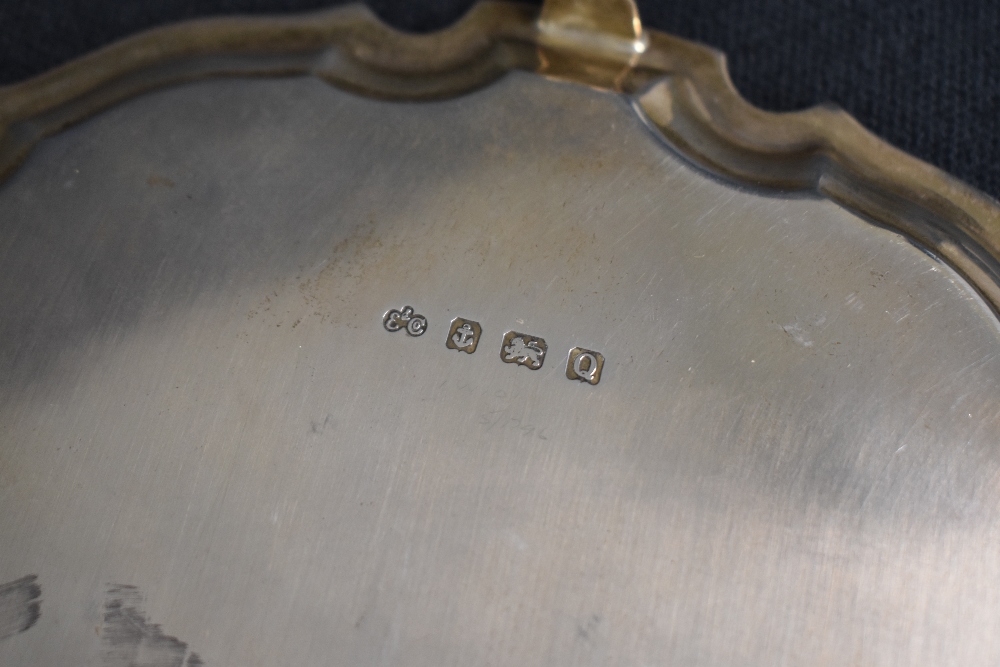 A George VI silver salver, of circular form having a Chippendale style rim, with a central - Image 3 of 4