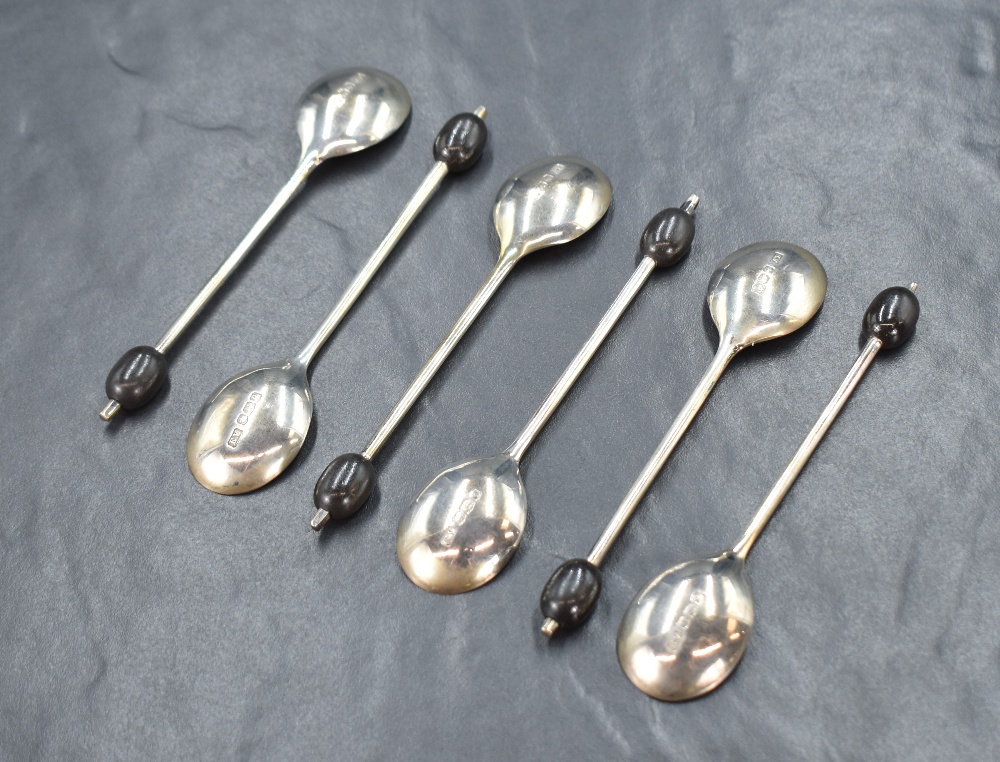 A cased set of six George V silver coffee bean spoons, having black coffee beans to the terminals, - Image 2 of 4