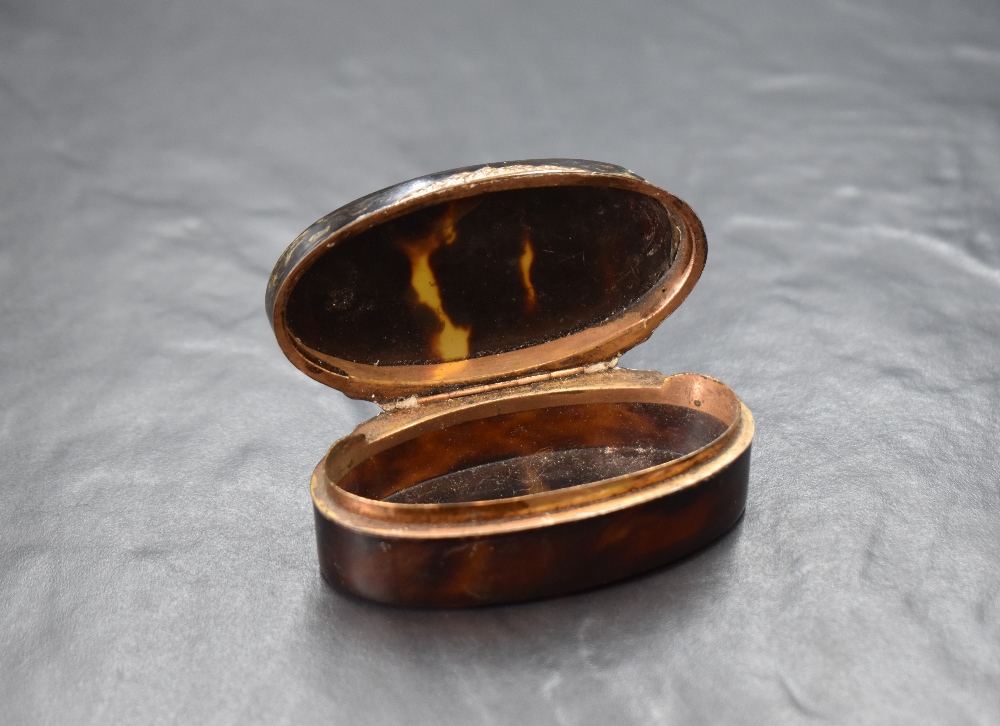 A 20th century white metal inlaid tortoiseshell trinket box, of hinged oval form having a vacant - Image 3 of 6