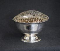 A George V silver rose bowl, of circular form having a Chippendale style rim with a filled centre,