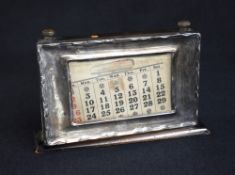 A George V silver mounted perpetual desk calendar, of rectangular form having rollers to mark days