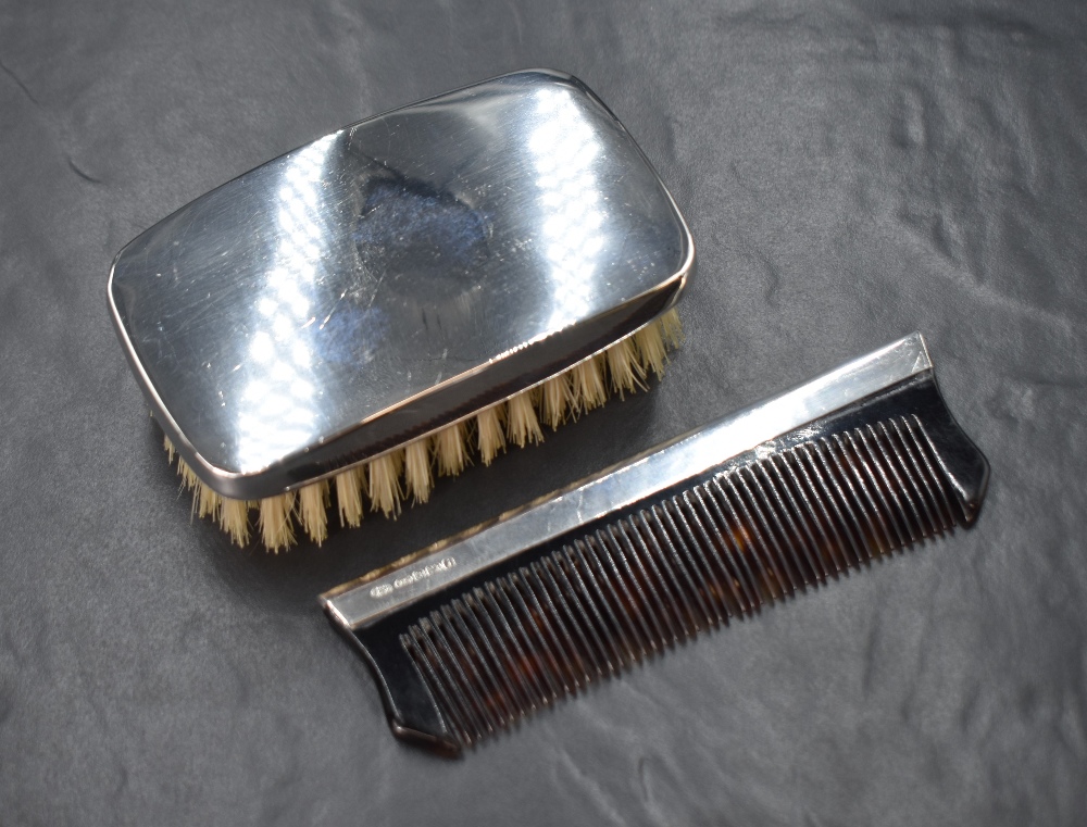 An Elizabeth II silver mounted gentleman's hair brush, of plain rectangular form, along with a - Image 2 of 4