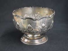 An early George V silver rose bowl, of circular form having a lobed scroll rim with embossed