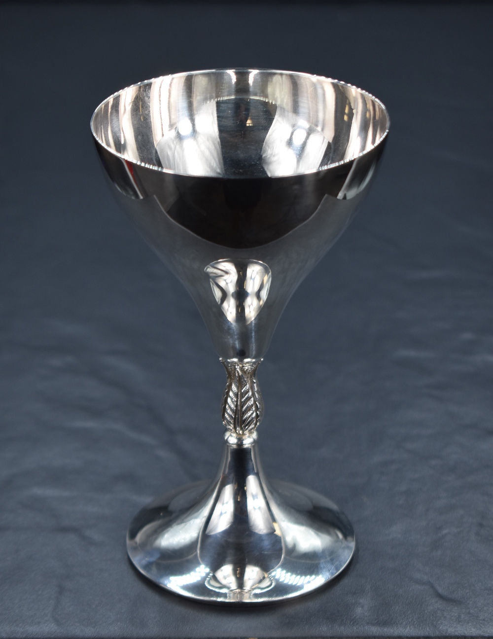 An Elizabeth II silver goblet, of traditional form raised on a knopped foliate stem and circular