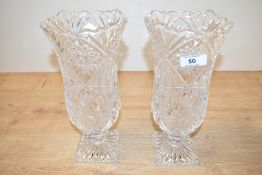A pair of cut crystal tulip vases supported on a square base, h26cm