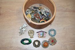 A collection of brooches and pins, including paste set examples, cameo and statement pieces