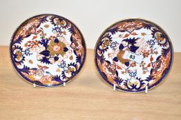 A pair of 19th century Derby porcelain saucers, decorated in the Imari style, painted makers mark to