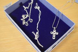 A small collection of silver and white metal necklaces, comprising a silver curb link neck chain,