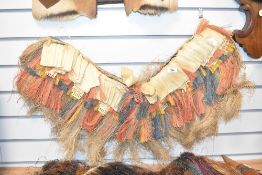 A Pulpul grass skirt with multi-coloured fibre band, L72cm