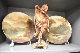 A 19th century Chinese carved boxwood figure of an Immortal having inset glass eyes on a pierced