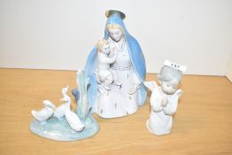 A Ronzan porcelain Madonna and Child, hand coloured in gold and blue, makers mark to base, h21cm,