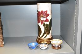 A late 19th century George Jones vase, hand coloured with floral pattern on a gilt base, h31cm, sold