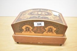 An ornate inlaid wooden musical jewellery box, containing a small collection of costume jewellery