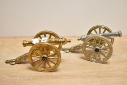 A pair of brass cannons decorated with GR military marks, stamped to base 'Made in England', h9cm