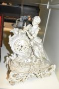 A battery operated figural mantel clock depicting and cherub, measuring 39cm tall, marked 'Crosa'