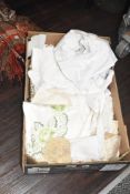 A box containing various lace, to include table cloth ect
