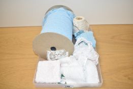 A lace haberdashery bundle containing a large quantity of baby blue lace edging 1.75' wide on a