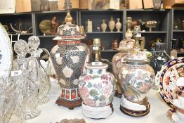 A group of four vintage oriental style ginger jar lamps, largest measuring 49cm tall.