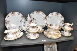 A Royal Albert cottage pattern bone china dinner service decorated with floral patterns and gilt