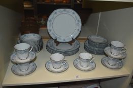 A contemporary fine bone china Noritake Blue Hill pattern tea service decorated with blue foliage on