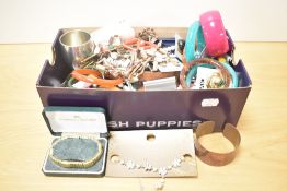 A large assortment of costume jewellery, including clip on earrings, beaded necklaces, bangles, drop