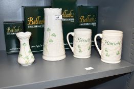 A pair of Belleek his and hers fine Parian china mugs, h11cm, sold together with two Belleek