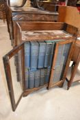 An early 20th Century oak bookshelf containing set of Encyclopedia Britannica (13th Edition)