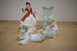 A Royal Doulton Pretty Ladies Christmas Day figurine, two Lladro cherub figurines and a Burlington