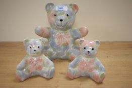 Three Park Rose pottery Bridlington bears, hand coloured with blue and pink foliage, largest h17cm.