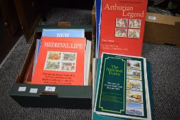 A folder containing a large collection on stamps with descriptions and a selection of Post Office