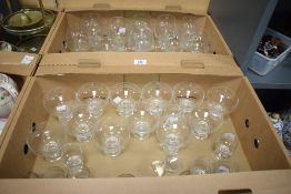 A large collection of various vintage liqueur glasses, decorated having etched floral pattern,