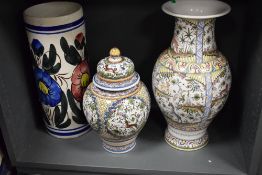 A large mid-century Portuguese vase, hand painted depicting various flora and fauna in the 17th