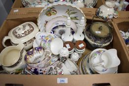 Two Portmeirion Botanic Garden pots having wooden lids 4' in height, two Portmeirion bottles one