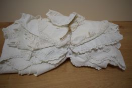 A collection of 20th century furniture surface protectors, in shades of off-white cotton and lace,